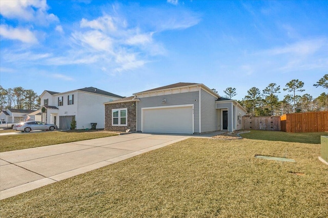 ranch-style home featuring a garage and a front lawn