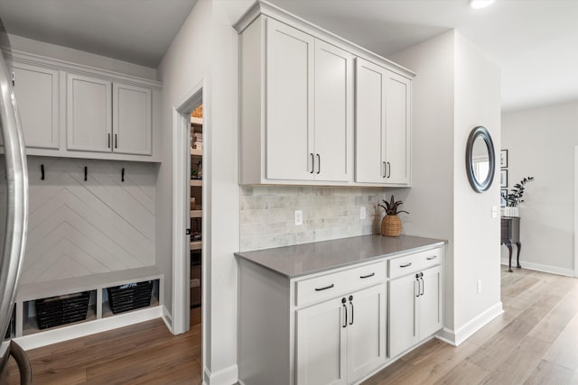 mudroom featuring baseboards and light wood-style flooring