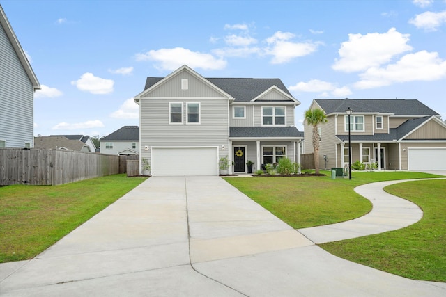 view of front of home with fence, board and batten siding, concrete driveway, and a front yard