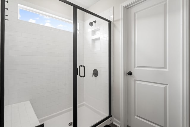 full bathroom featuring a shower stall