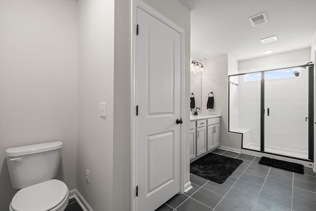 bathroom featuring tile patterned flooring, vanity, toilet, visible vents, and a stall shower