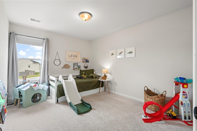 recreation room with visible vents and carpet floors