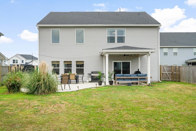 back of property with a lawn, a patio, a fenced backyard, and outdoor lounge area