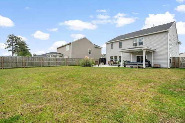 rear view of house featuring a patio, a fenced backyard, a ceiling fan, and a lawn