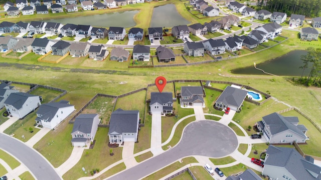 aerial view with a water view and a residential view