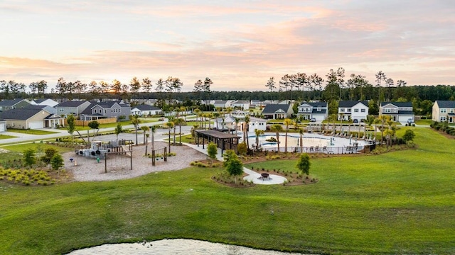 aerial view at dusk featuring a residential view
