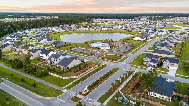 bird's eye view featuring a residential view and a water view