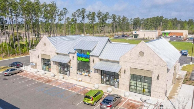 view of building exterior with uncovered parking