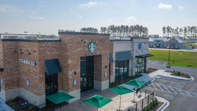 view of property featuring uncovered parking