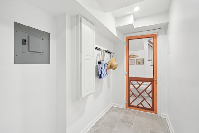 entryway featuring electric panel and light tile patterned floors