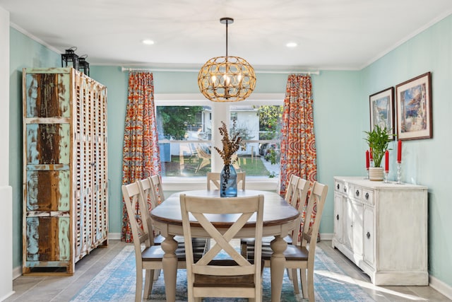 tiled dining area with an inviting chandelier and crown molding