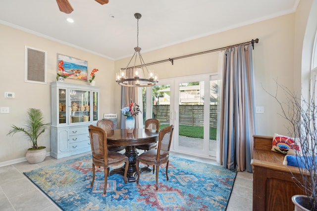 tiled dining area with ceiling fan with notable chandelier and ornamental molding