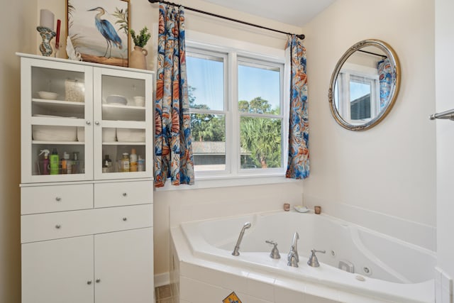 bathroom with tiled bath