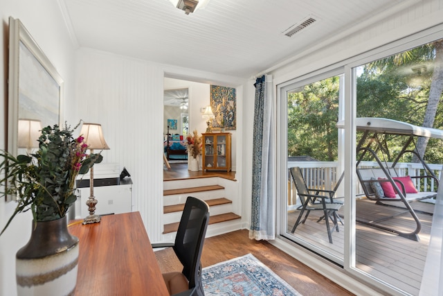 office space with hardwood / wood-style flooring and crown molding