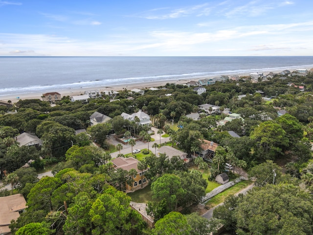 drone / aerial view featuring a water view and a view of the beach