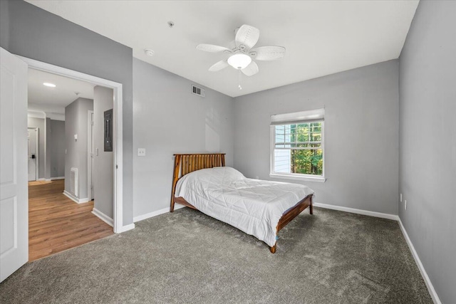 bedroom with dark colored carpet and ceiling fan