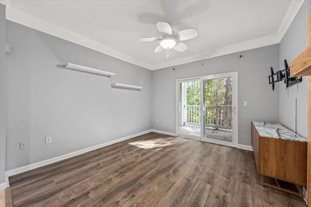 unfurnished room with ceiling fan, dark hardwood / wood-style floors, and ornamental molding