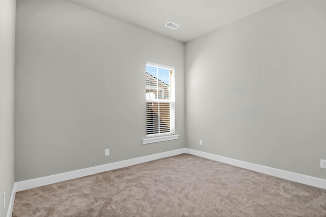 empty room with light colored carpet