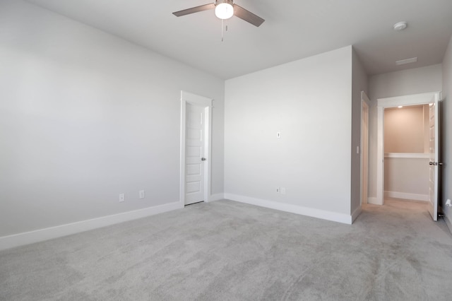 unfurnished bedroom featuring light carpet and ceiling fan