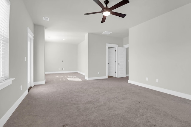 carpeted empty room featuring ceiling fan