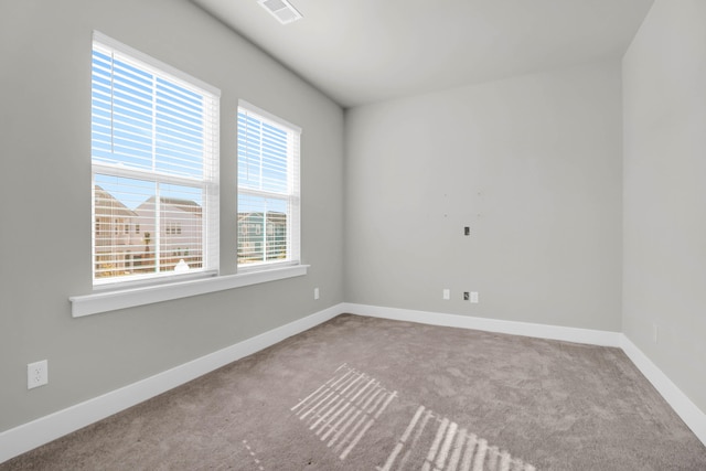 unfurnished room with light colored carpet