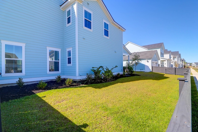 view of home's exterior with a yard