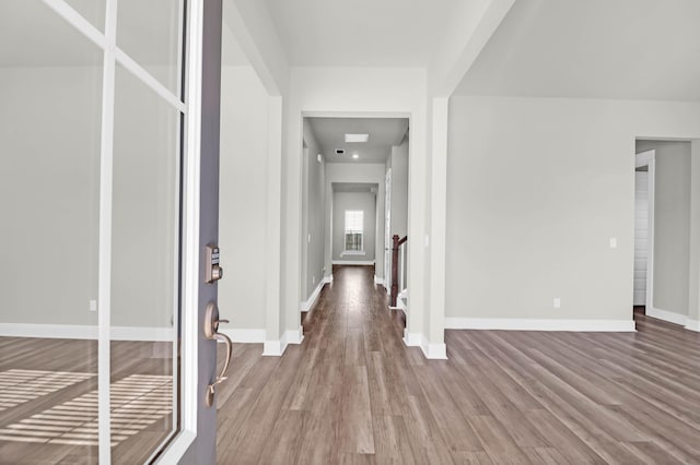 corridor with light wood-type flooring