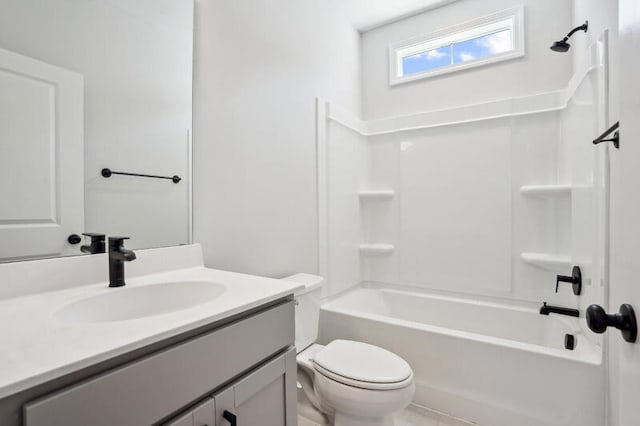 bathroom featuring toilet, bathtub / shower combination, and vanity