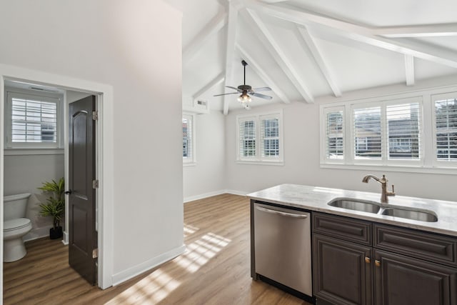 kitchen featuring dishwasher, lofted ceiling with beams, sink, light hardwood / wood-style flooring, and ceiling fan