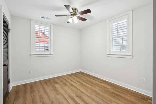 unfurnished room with ceiling fan and light hardwood / wood-style floors