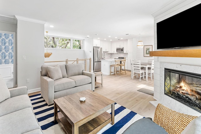 1355 Dunlin Ct Share D, Unit Share D, Kiawah Island, SC 29455 - living room with light wood-style flooring, recessed lighting, crown molding, and a fireplace with flush hearth