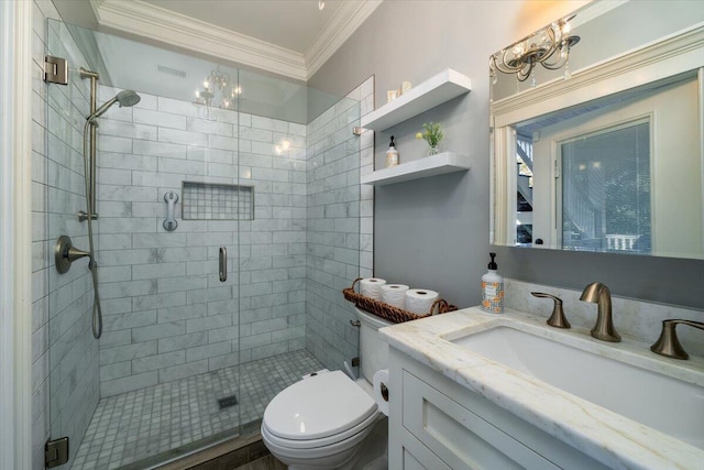 bathroom featuring vanity, ornamental molding, a shower with shower door, and toilet