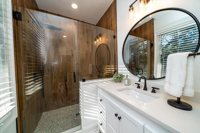 bathroom with vanity and an enclosed shower