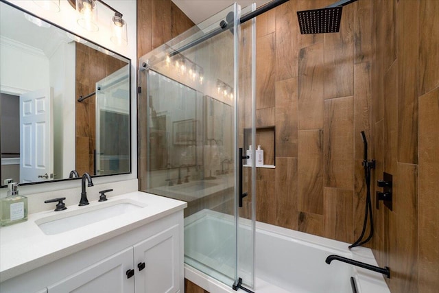 bathroom with vanity, enclosed tub / shower combo, and ornamental molding