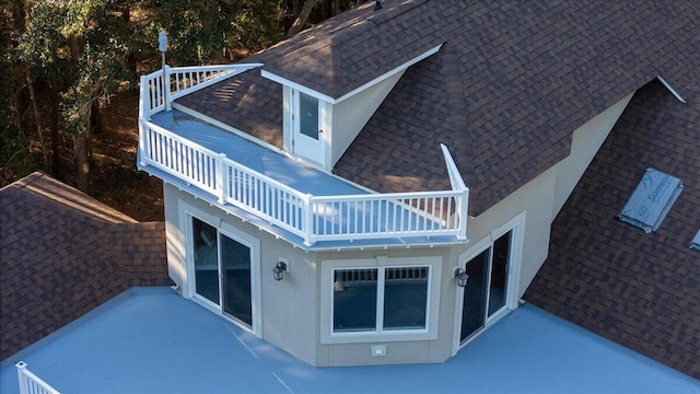 rear view of house featuring a balcony