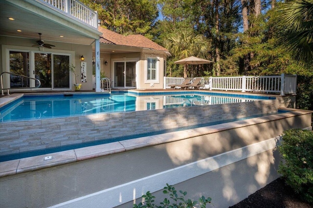 view of swimming pool with ceiling fan