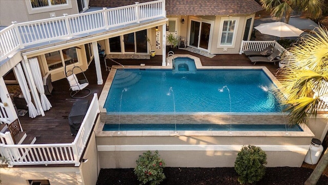 view of swimming pool with pool water feature