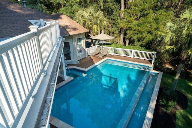 view of swimming pool with a wooden deck