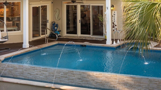 view of swimming pool featuring pool water feature