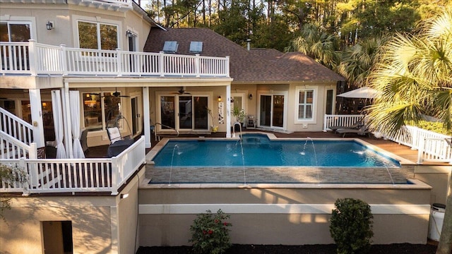 view of swimming pool featuring pool water feature