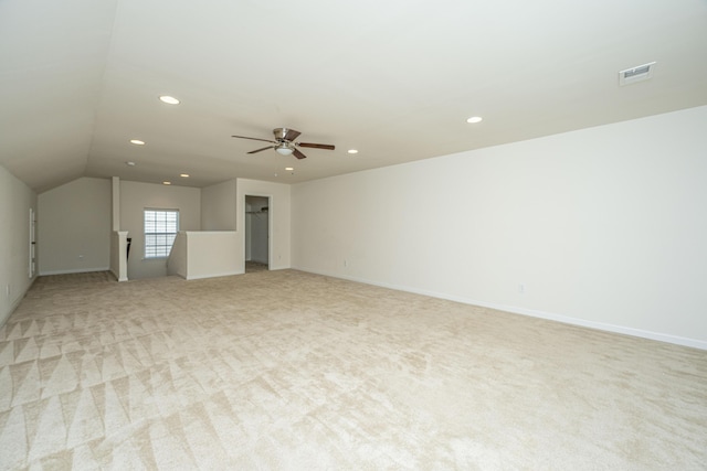 interior space featuring ceiling fan and vaulted ceiling