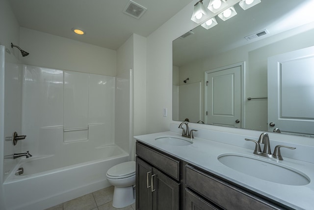 full bathroom with tile patterned floors, toilet, shower / bath combination, and vanity