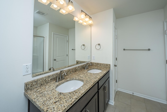 bathroom with tile patterned floors and vanity