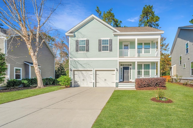 view of property featuring a garage, a balcony, and a front lawn