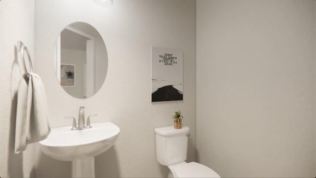 bathroom with sink and toilet