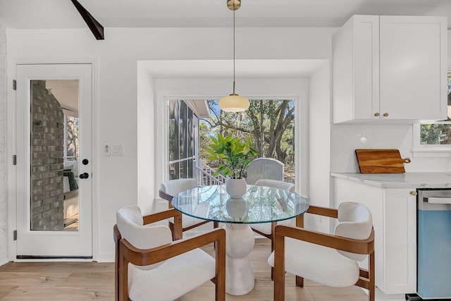 dining area with light wood-style floors