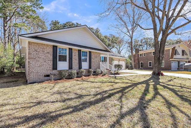 view of front of property featuring brick siding, an attached garage, a front lawn, crawl space, and driveway