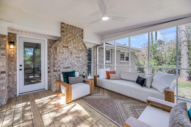 unfurnished sunroom featuring plenty of natural light and ceiling fan