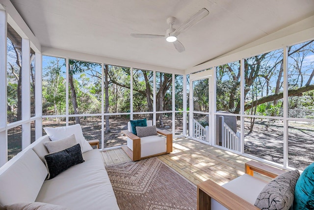 sunroom with a wealth of natural light and ceiling fan