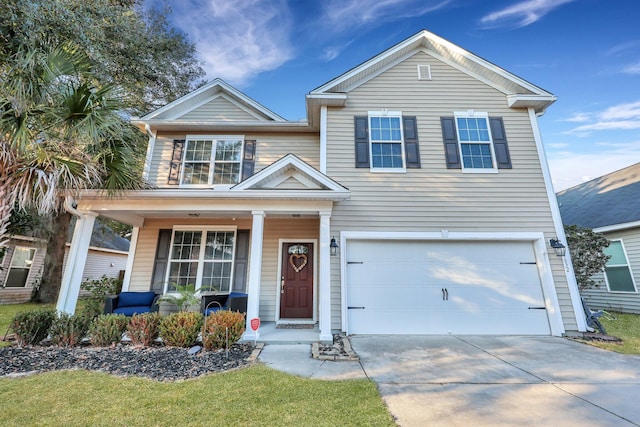 view of front of house with a garage and a porch